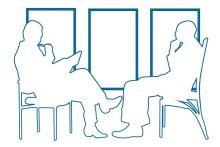 two humans outlined in blue sit in chairs across from eachother